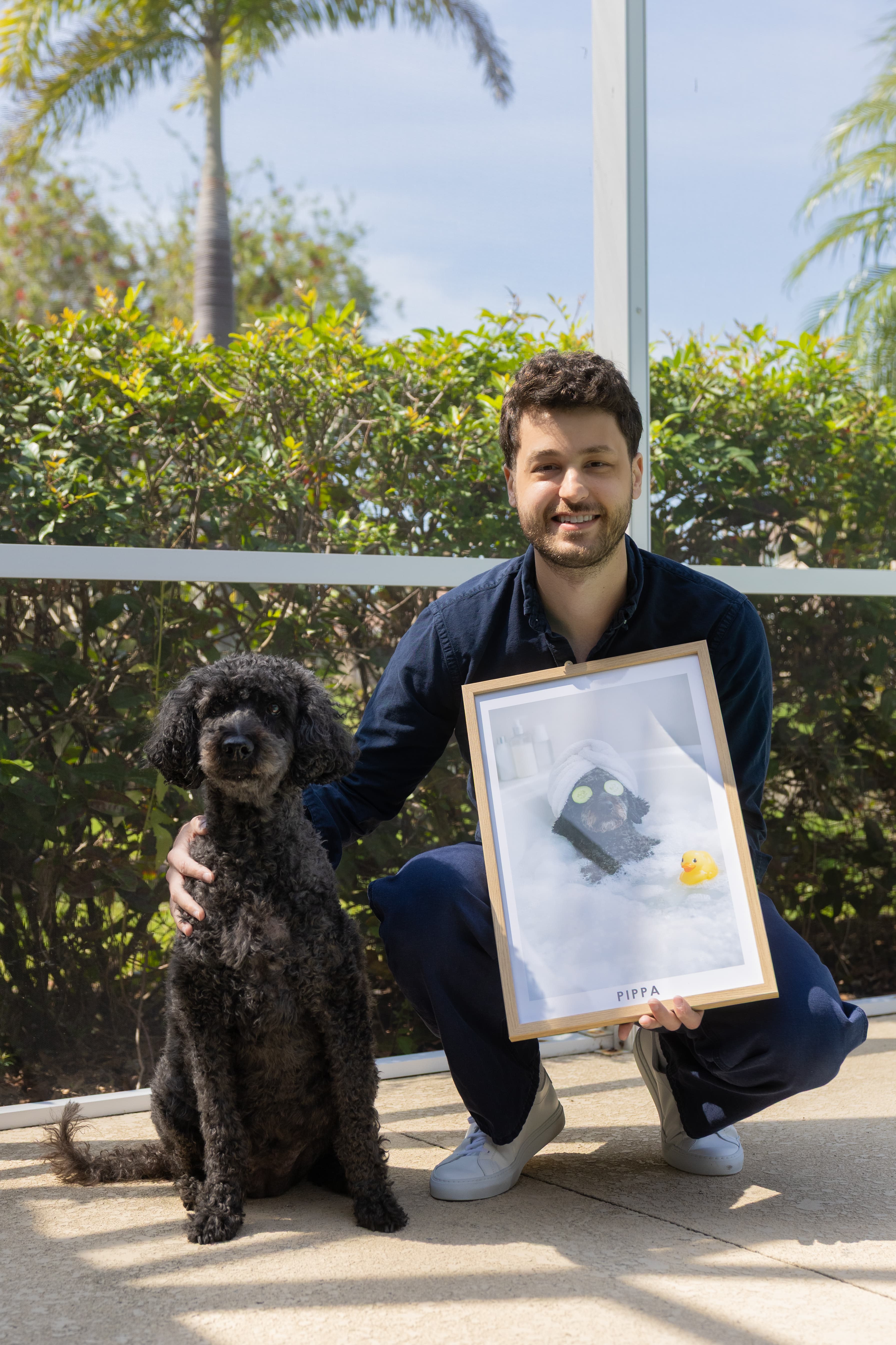 Benjamin Weisman with Pippa and her framed spa day portrait